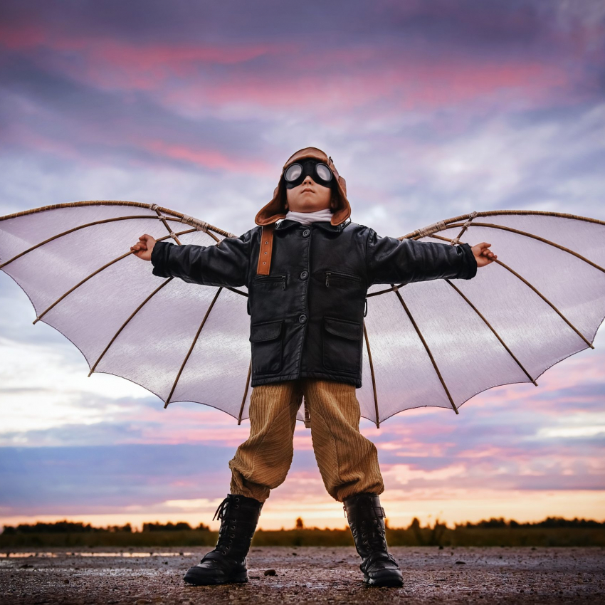 Boy,With,Wings,At,Sunset,Imagines,Himself,A,Pilot,And